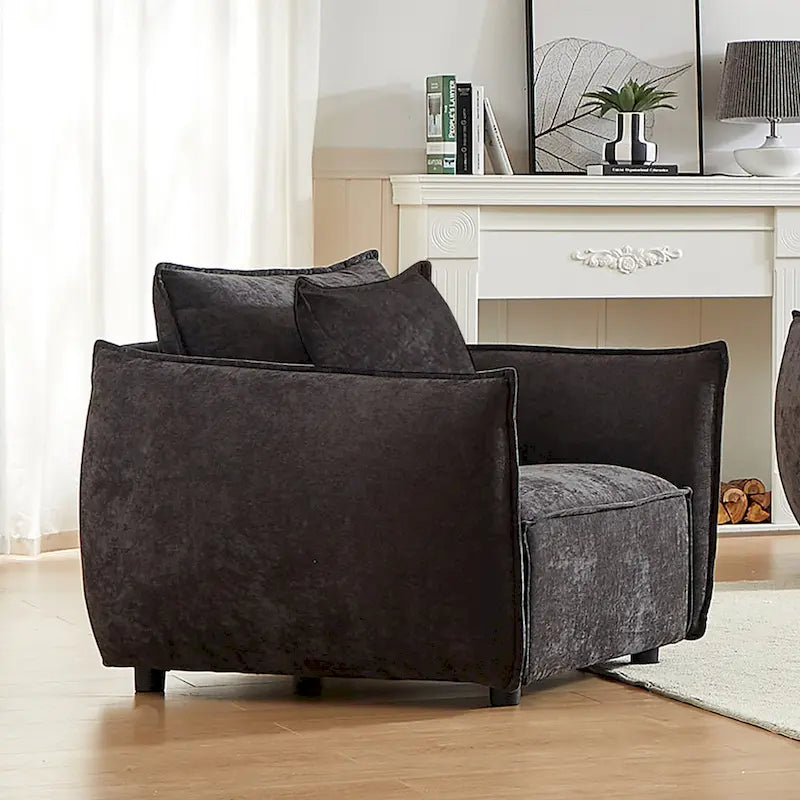 Black Upholstered Arm Chair with Pillows and Wide Cushion
