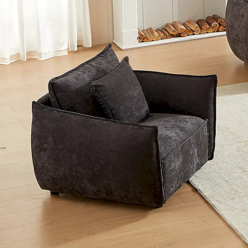 Black Upholstered Arm Chair with Pillows and Wide Cushion